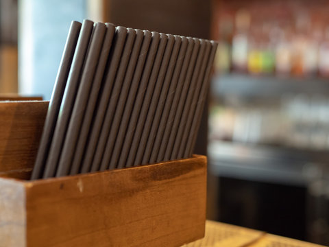 Container Filled With Paper Straws At A Bar