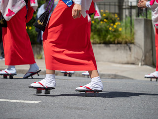 Women marching in Japanese sandals (geta) during a parade