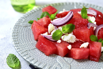 Watermelon salad with feta and red onion.