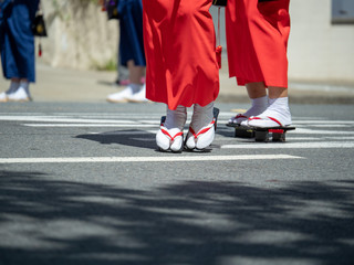 Women wearing geta footwear walking along the streets