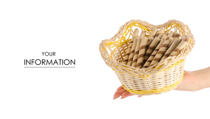 Obraz premium Wafer tubes sweet stick delicious in a basket in hand pattern