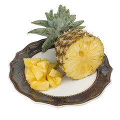 pineapple on dish half isolated on white background