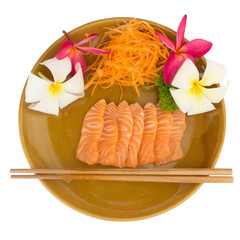 Salmon sashimi on dish with flower isolated on white background