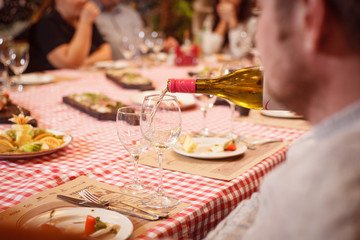 the table is served with glasses for white wine