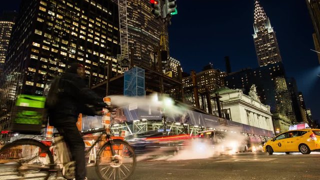 Time Lapse video of a long line of cars, taxi, buses and people on the 42nd street of Manhattan, New York City, USA.