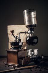 Japanese siphon coffee maker on old kitchen table