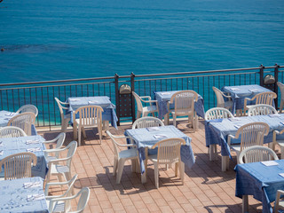 Restaurant on a terrace overlooking the sea.
