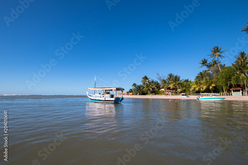 Tropical Island With Fishing Boat In The Sea Tropical Island With Fishing Boat In The Sea