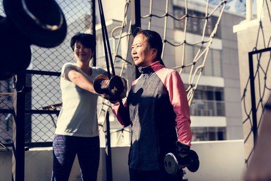 People exercising at fitness gym