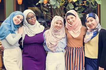 Group of islamic friends arms around and smiling together