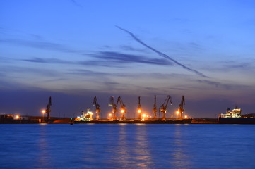 Fototapeta premium Port crane bridge and bulk carrier