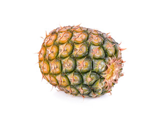 unpeeled fresh pineapple on white background