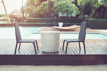 Fototapeta premium swimming pool chair on the resort close to the beach, look at beautiful sea view.
