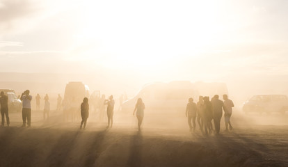 people in the desert with dust