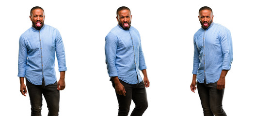 African american man with beard feeling disgusted with tongue out