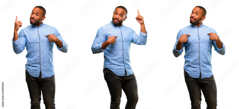 Poster african american man with beard happy and surprised cheering expressing wow gesture pointing up