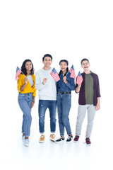 Obraz premium smiling multiethnic students with usa flags isolated on white