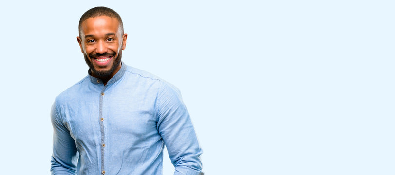 African american man with beard confident and happy with a big natural smile laughing isolated over blue background