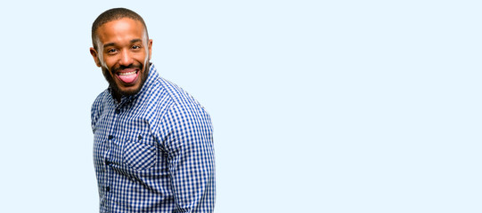 African american man with beard sticking out tongue at camera at sign of disobedience, protest and...