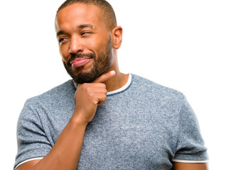 African american man with beard thinking thoughtful with smart face, expressing question and doubt. Imagine the solution isolated over white background