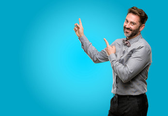 Middle age man, with beard and bow tie pointing away side with finger