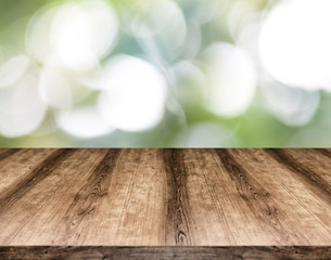 Naklejka na ściany i meble Wooden empty table board in front of blurred background. Can be used for display or montage any product. Mock up for display your product.