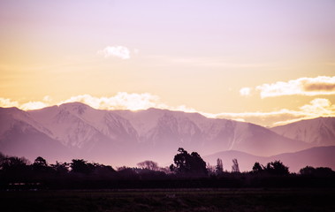 Sunset over the Snow Capped Southern Alps of New Zealand in winter.