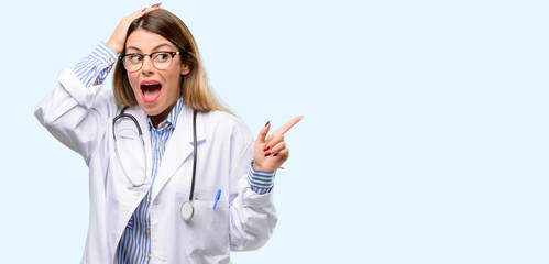 Young doctor woman, medical professional pointing away side with finger