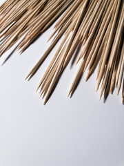 Sharp bamboo skewers on a white table