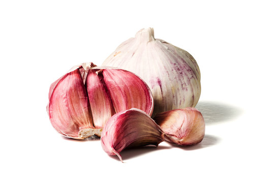 Garlic cloves and bulb isolated on white background