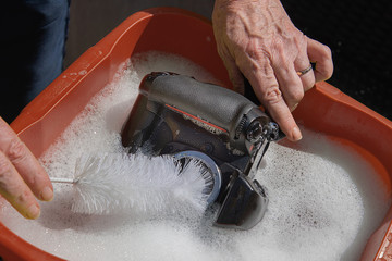 An amusing look of the incorrect way to clean a camera sensor and mirror with soap and water