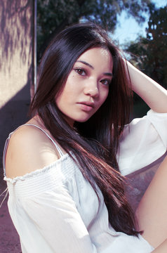 Beautiful young Asian Model with long gorgeous hair