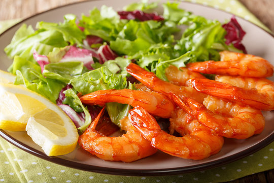 Honey Soy King Prawns And Fresh Salad Close-up On A Plate. Horizontal