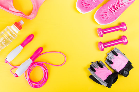 Pink Things For Sports, On A Yellow Background, Fitness Training For Weight Loss