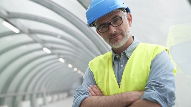 Portrait of industrial engineer with security hat and lifevest
