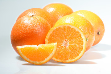 Orange and orange slices isolated on the white background