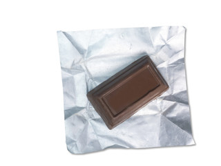 Chocolate in foil on the white background.