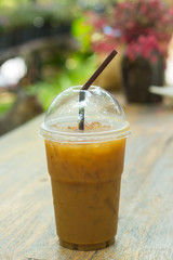 Ice coffee on a wooden table