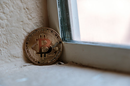 Bitcoin next to diry window
