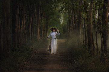 Beautiful woman with Vietnam culture traditional dress,traditional costume ,vintage style,Vietnam.