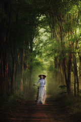 Beautiful woman with Vietnam culture traditional dress,traditional costume ,vintage style,Vietnam 