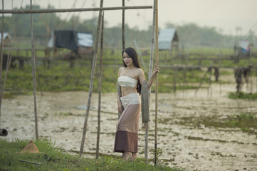 Beautiful woman Thai traditional culture on silhouette background.