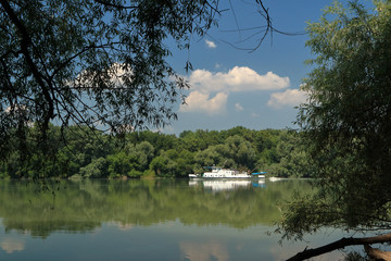 ship sails along the river.