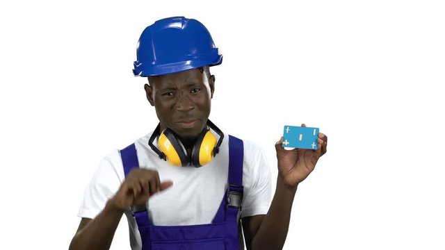 African American builder lifts blue card and shows thumbs down . Alpha channel
