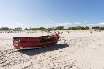 Old wooden fishing boat at the beach of the Baltic Sea