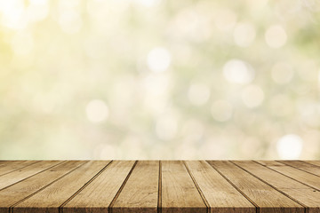 Wood floor with blurred trees of nature park background and summer season, product display montage