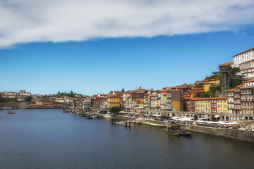 Fototapeta na wymiar Embankment of Douro River. Colorful houses of Porto. Portugal.