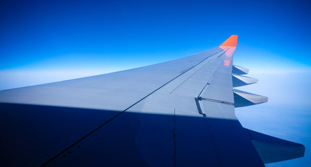 Close up Airplane window with airplane wing