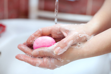 Soap in hands. Hand washing and hygiene.