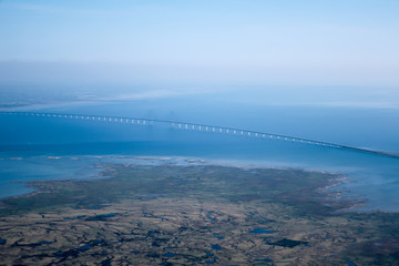 Fototapeta premium The Øresund or Öresund Bridge, longest combined road and rail bridge in Europe strait between Sweden and Denmark.